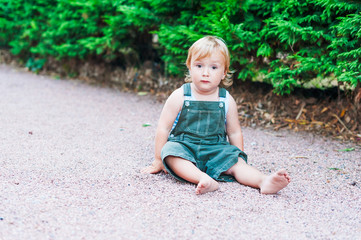 Summer portrait of adorable toddler boy