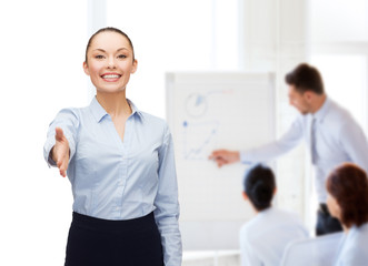 businesswoman with opened hand ready for handshake