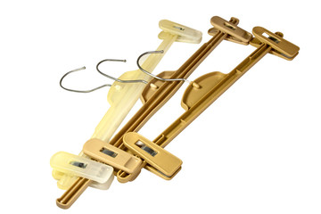 Three Brown Plastic Coat Hangers With Metal Hooks