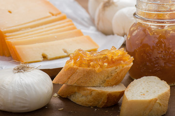 Onion marmalade on bread with sliced ​​cheese