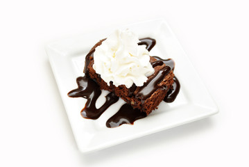 Cake Brownie with Chocolate Syrup and Cream