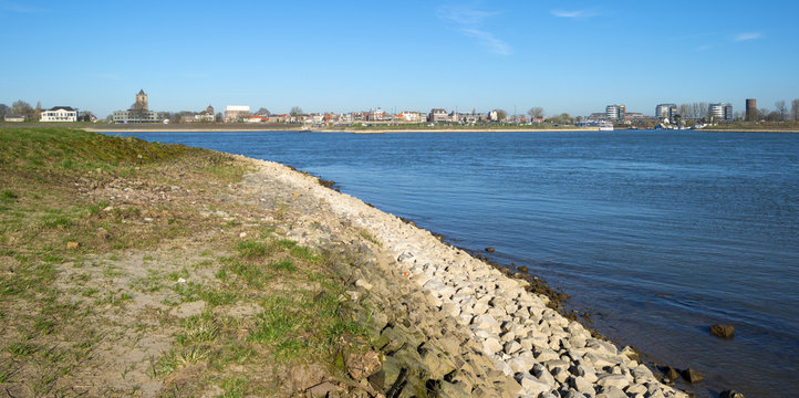 Skyline of a village along a sunny river