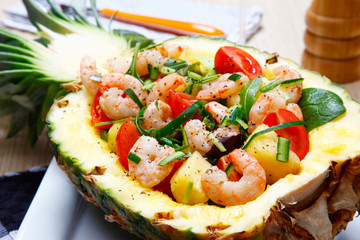 Shrimps salad in a pineapple.