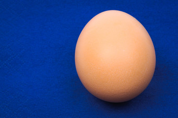 Close-up of Easter blank egg over blue background
