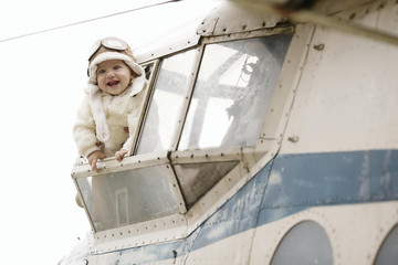 sweet little baby dreaming of being pilot