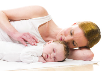 Newborn baby sleeping with mother