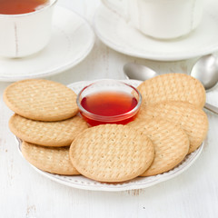cookies with jam and cups of tea