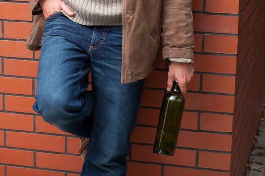 Adult man with bottle of wine