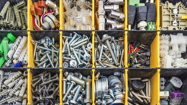 Screw and dowel in plastic organizer box