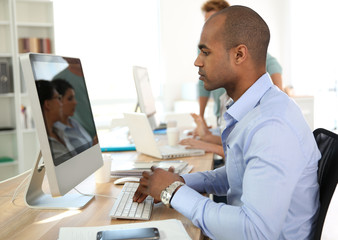 Portrait of young businessman in office