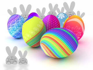 Easter bunnies and colorful eggs isolated on white background