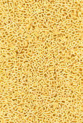 Background of pasta in the form of numbers and letters
