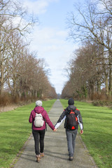 Two young adults walking together