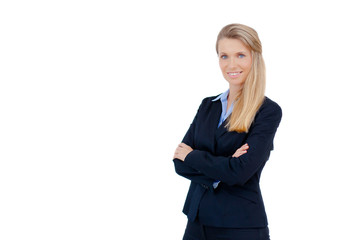 Obraz premium Blond businesswoman standing with crossed arms