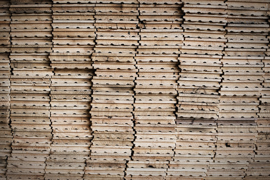 A reclaimed lumber workshop. Stacks of reclaimed, cleaned up planks of wood for re-use. 