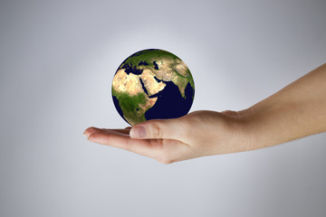 The Earth in a female hand