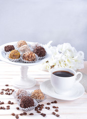 Set of chocolate candies on table on light background