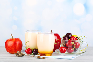 Delicious yogurt with fruits tastes in glasses and fresh fruits