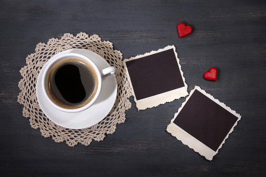 Composition with coffee cup, decorative hearts and old blank