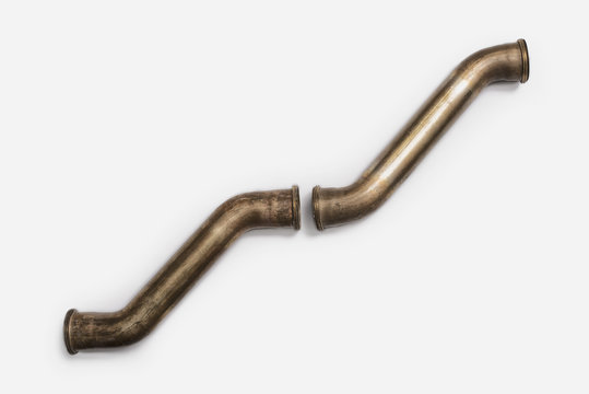 Copper Plumbing Pipe Sections. Two pieces of copper pipe.  Shiny formed shaped pieces.