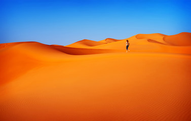 Fototapeta na wymiar Woman traveler in desert