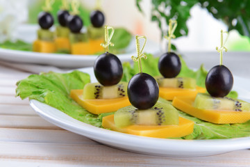 Delicious canapes on table close-up
