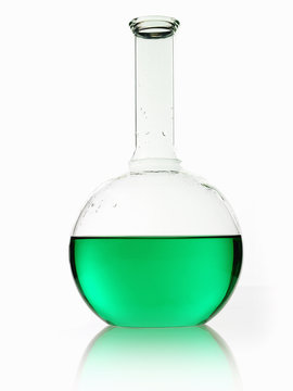 A rounded glass scientific chemical flask with a long funnel neck, holding green liquid. 