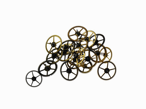 Watch gears, small precision made cog wheels with spokes and fine teeth or notches around the edge. Arranged in a pile. 