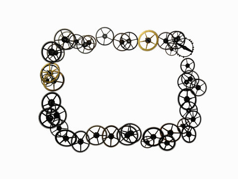 Watch gears, small precision made cog wheels arranged in a rectangular frame shape. The moving parts of a watch.