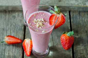 Strawberry smoothie on a wooden table