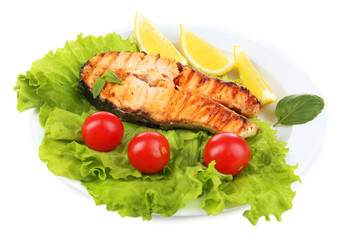 Tasty grilled salmon with vegetables, isolated on white