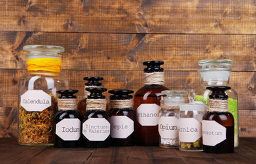 Historic old pharmacy bottles with label   on wooden background