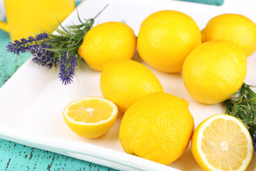 Fototapeta na wymiar Still life with fresh lemons and lavender on wooden table