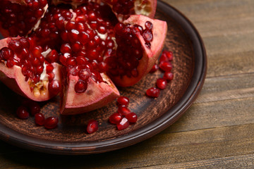 Ripe pomegranate on table close-up