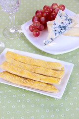 Cheese, grape and bread sticks