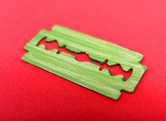 Razor blade on color background