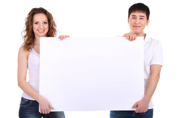 Two beautiful young people holding blank poster isolated