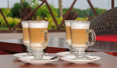 Fresh cappuccino  wooden table