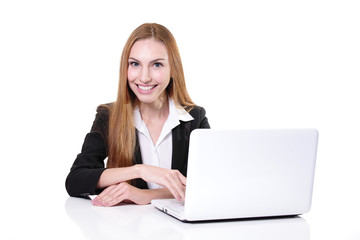 Young cheerful businesswoman sitting at the table