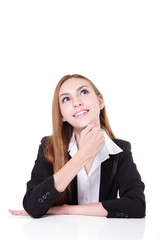 Young businesswoman sitting on the desk thinking something