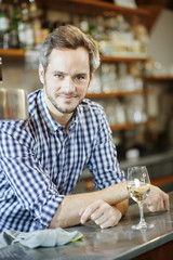 young bartender at his workplace