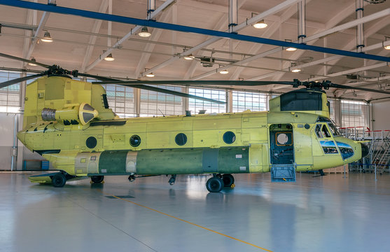 Chinook helicopter parked  in hangar