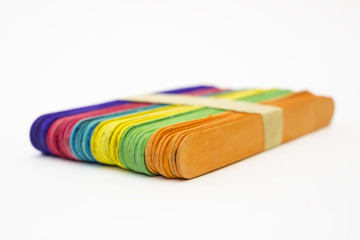 Isolated bundle of colorful ice cream sticks on white background
