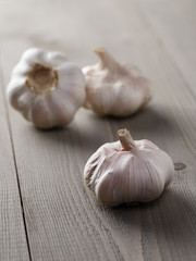 whole garlic on wood table