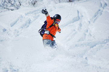 Fototapeta na wymiar Snowboarder in action