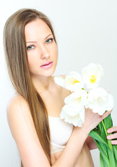 Portrait of a beautiful woman with flowers.