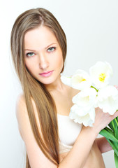 Portrait of a beautiful woman with flowers.