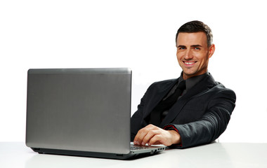 Smiling businessman sitting at the table