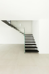 Interior, modern staircase in empty house.