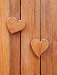 wooden hearts on wooden background